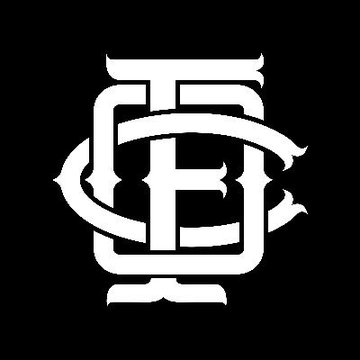 A stylized monogram logo with the intertwined letters "OF" in an ornate white font on a black background, representing OneFootball's brand identity in a post critiquing the company's "Fandom Economy" concept.
