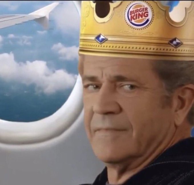 A middle-aged man wearing a Burger King paper crown looks sideways with a skeptical, side-eye expression while seated next to an airplane window showing sky and clouds.

The image humorously illustrates the post's irony of "dumb enough" vs. "smart enough"—the man's sideways side-eye and dubious look embody the self-aware acknowledgment of avoiding a Bitcoin fork, treating the Burger King crown as a satirical symbol of being outsmarted (or crowned) by the situation.