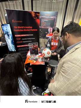 A booth at Malaysia Blockchain Week 2026 showcases ForeGate, advertised as "The World's Leading Prediction Market Platform," where attendees gather around a display featuring a signed Michael Owen jersey alongside a young mascot holding a soccer ball.