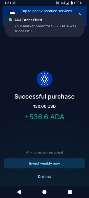 A mobile phone screenshot showing a successful cryptocurrency purchase of 536.6 ADA for 130.00 USD, with a notification confirming "ADA Order Filled" and a button to "Invest weekly now."