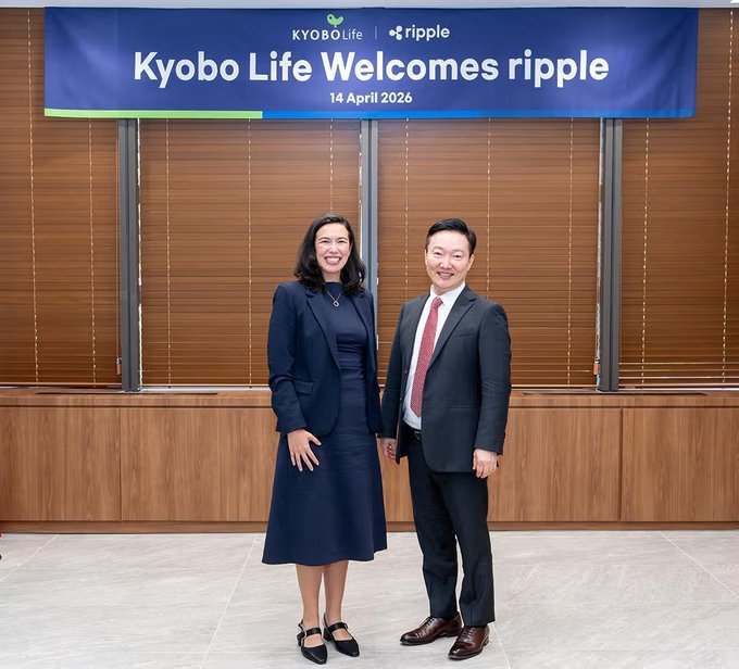 A corporate photograph of a woman in a navy dress and a man in a suit standing in front of a banner that reads 'Kyobo Life Welcomes ripple,' dated 14 April 2026, with Kyobo Life and Ripple logos.