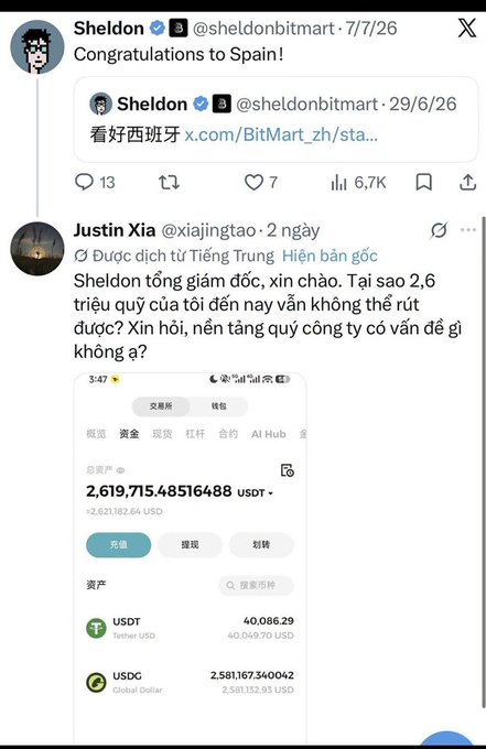 A screenshot of an X (Twitter) post by Sheldon (@sheldonbitmart) congratulating Spain, followed by a reply from Justin Xia (@xiajingtao) complaining about being unable to withdraw $2.6 million in USDT from the platform.