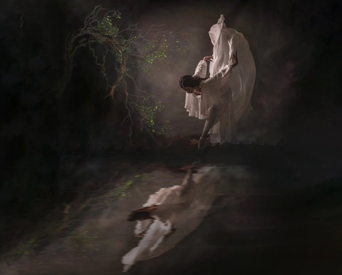 Surreal painting of a figure in flowing white robes dancing near a twisted tree with green leaves, their reflection visible in dark water below.