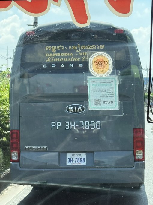 Back view of a Cambodia-Vietnam Limousine bus with the text 'GRAND B' visible, license plate 'PP 3H-7898', and a KIA logo on the rear.