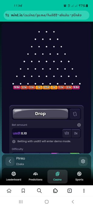 A mobile phone screen captures a Plinko game on mint.io, showing a betting amount of 0.10 USDT and a 'Drop' button.