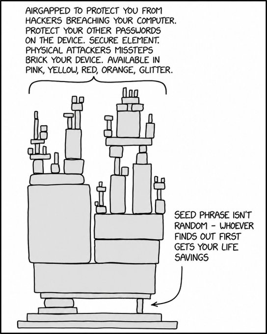 The cartoon depicts a tall, complex stack of hardware resembling a Coldcard Bitcoin hardware wallet, labeled as "AIRGAPPED TO PROTECT YOU FROM HACKERS BREACHING YOUR COMPUTER... AVAILABLE IN PINK, YELLOW, RED, ORANGE, GLITTER," with a pointed note warning that the "SEED PHRASE ISN'T RANDOM — WHOEVER FINDS OUT FIRST GETS YOUR LIFE SAVINGS," humorously highlighting the irony that the device's robust security features can't protect against someone discovering the recovery seed.