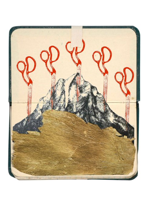 An artistic journal spread featuring a painted black mountain emerging from golden textured paper, with five red-handled scissors mounted in a row across the page.