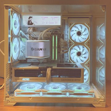 A custom-built gaming PC in a Lian Li case featuring an MSI GeForce RTX graphics card, white fans, and RGB lighting.