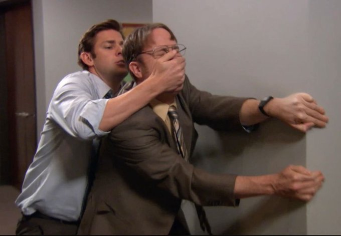 The image shows a scene from *The Office* where Jim Halpert covers Dwight Schrute's mouth with his hand while pinning him against a wall, captioned with a humorous call-to-action suggesting the viewer take revenge on someone who "slashed" their ethos by leaving a negative review, mirroring the physical silencing and retaliation depicted in the scene.