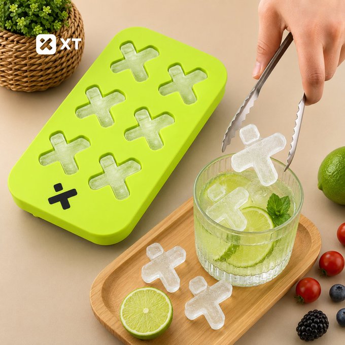A green silicone ice tray molds cross-shaped ice cubes, which are being placed with tongs into a glass of lime and mint drink, accompanied by fresh fruit on a wooden tray, with the "XT" logo displayed in the corner—visually reinforcing the post's message of keeping cool and composed during market fluctuations.