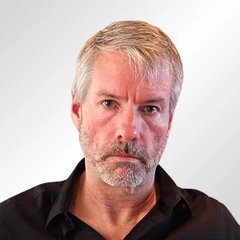 A portrait photo of Michael Saylor, the MicroStrategy (now Strategy) executive, accompanies the post referencing his company reportedly selling $100 million in Bitcoin ($BTC), potentially to buy back $STRC preferred shares.