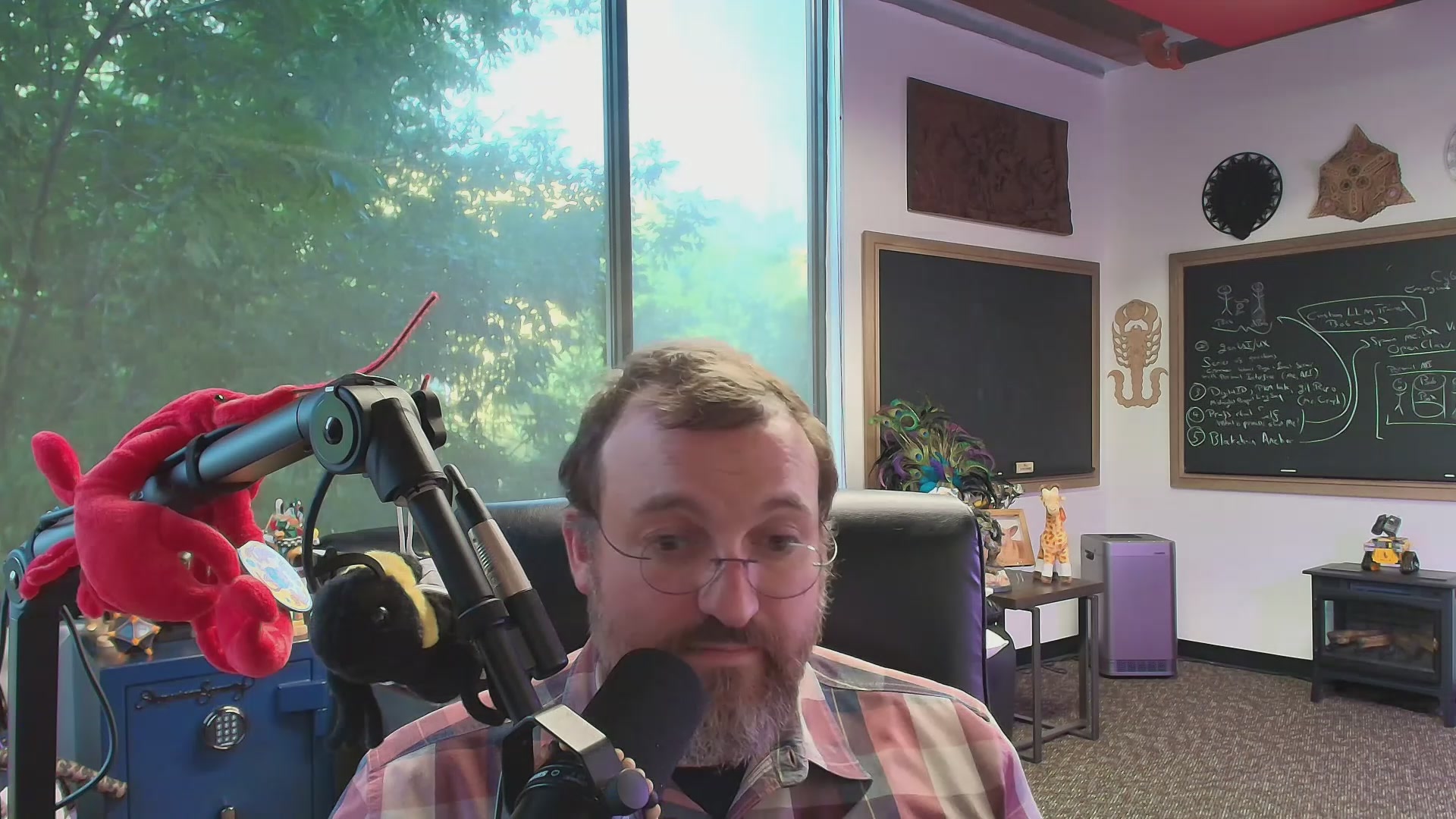 Charles Hoskinson, a well-known author and blogger, has written an article titled "Why is Cardano the only ecosystem that can run the world?". The image features a man sitting behind a microphone, suggesting he is hosting or participating in a podcast discussion on this topic. The presence of a red stuffed animal on the left side of the frame adds a playful touch to the scene. The post also includes an image of a blackboard with a graph and text, which could be related to Charles' article about Cardano's unique ability to run the world.