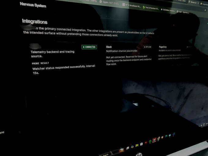 A dimly lit computer screen displays a 'Nervous System' Integrations page showing a 'Telemetry backend and tracing source' marked as CONNECTED, with a probe result of 'Watcher status responded successfully. Interval: 15s.'