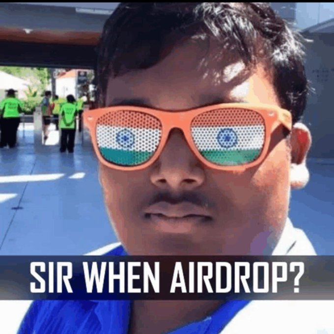 A close-up photo of a young man wearing orange sunglasses with the Indian flag reflecting in the lenses, featuring bold white text at the bottom reading "SIR WHEN AIRDROP?" — humorously capturing the impatience of the SODEX community, with the sunglasses reflecting the tricolor symbolizing patriotic anticipation for the Season 1 airdrop.