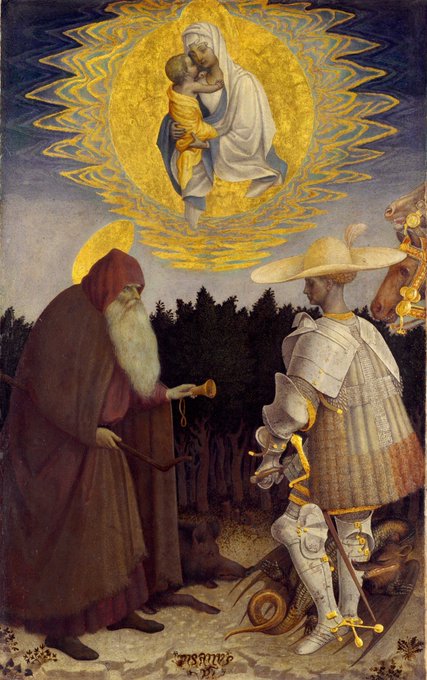 A Renaissance-style painting depicting the Madonna and Child in a golden mandorla above two saints—one bearded hermit in red robes holding a scroll, and a knight in silver armor with a plumed hat—set in a dark forest.