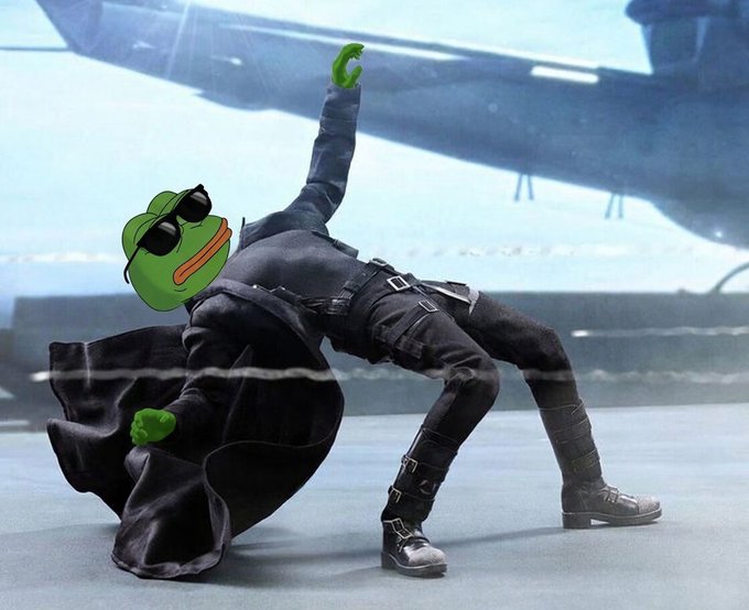 A character in black attire with a cape leans back dramatically with arms raised, with a cartoon Pepe the Frog face edited onto them and a helicopter visible in the background.