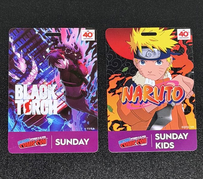 Two New York Comic Con 40th Anniversary badges for Sunday, one featuring 'Black Torch' and the other featuring 'Naruto'.