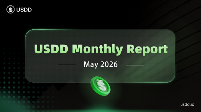 The image is a screenshot of a Udd website page, with a clear focus on the 'USDD Monthly Report'. The title appears at the top followed by an explanation that says "May 2026" in white text. An image of a green coin, potentially worth $1, is placed in the center of the scene and has the words "collateral data total collision" written around it, indicating the value or importance of this particular report. The post on the Udd website appears to be related to Bitcoin trading, with a discussion of how the Udd Monthly Report might impact this market.