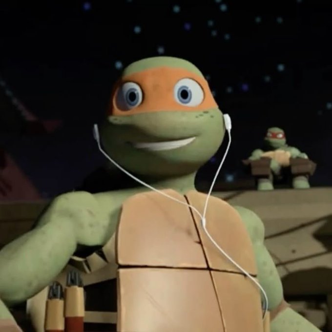 An animated Michelangelo from Teenage Mutant Ninja Turtles wears earbuds with a smiling expression, while another turtle sits in the background against a starry sky.