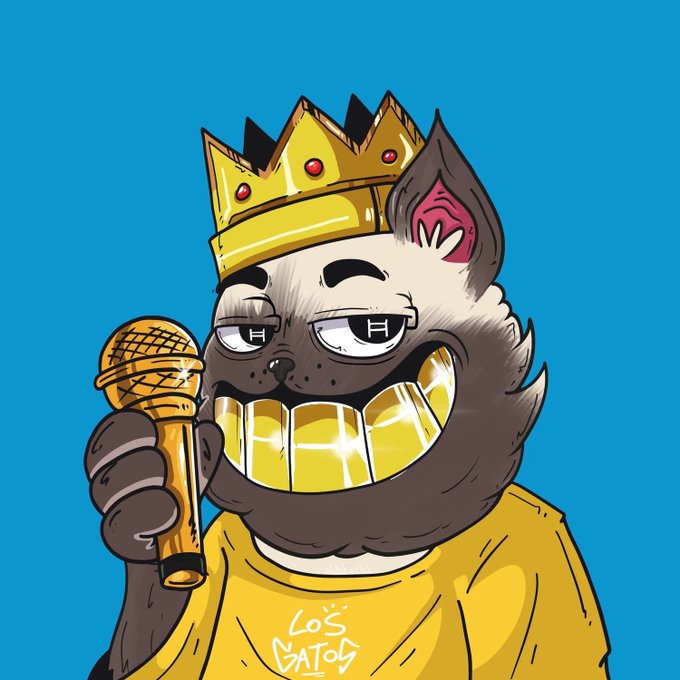A cartoon cat character wearing a golden crown and gold teeth smiles smugly while holding a gold microphone against a blue background, with "LO'S CATOS" text on its shirt—capturing the confident, "let's get it" energy of a hip-hop king ready to perform.