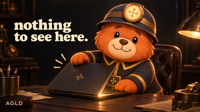 An illustrated orange bear character wearing a mining helmet with a headlamp sits at a desk holding a laptop, accompanied by the text "nothing to see here." and an "AGLD" logo.
