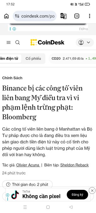 A mobile browser screenshot of a CoinDesk article titled 'Binance bị các công tố viên liên bang Mỹ điều tra vì vi phạm lệnh trừng phạt: Bloomberg' written in Vietnamese.