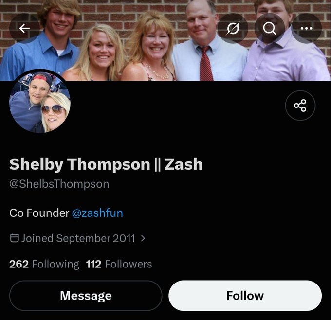 An X (Twitter) profile page for Shelby Thompson (@ShelbsThompson), Co Founder of @zashfun, showing a family photo as the header and a couple's photo as the profile picture.