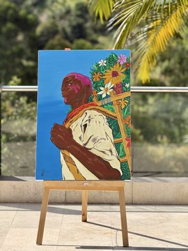 A colorful acrylic painting on an easel depicts a man with dark skin wearing a white shirt, positioned next to a vibrant floral arrangement against a blue background.