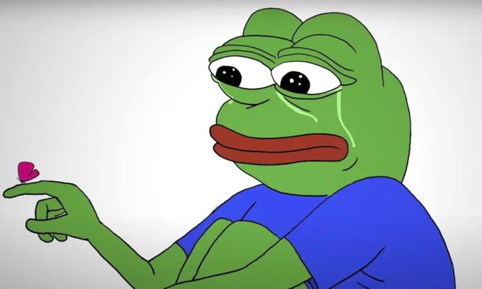Sad Pepe the Frog meme with a tear in his eye holding a small pink heart in his hand.