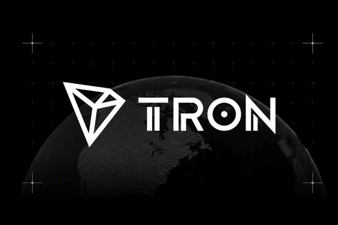 The TRON cryptocurrency logo is displayed in white against a black background, featuring the distinctive triangular emblem and a dotted globe design.