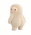 A small beige plush toy figure with a round head, small black eyes, and a simple smiling face, resembling a Yeti or similar creature.