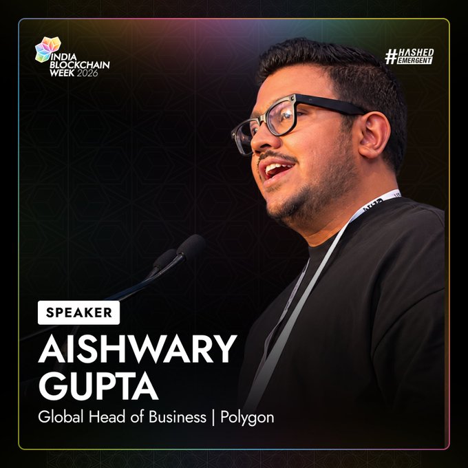 A promotional speaker graphic for India Blockchain Week 2026 features Aishwary Gupta, Global Head of Business at Polygon, shown speaking at a microphone with the event's logo and "#HashedEmergent" branding. The caption matches the post's announcement of his participation as a speaker at IBW2026, aligning his professional role at Polygon with the event's speaker lineup.
