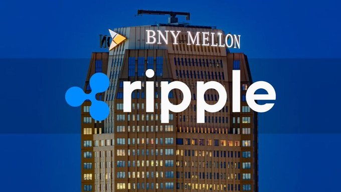 The image shows a BNY Mellon building with the company's logo and Ripple's logo superimposed, visually representing BNY Mellon's new role as primary reserve custodian for Ripple's RLUSD stablecoin amid its plans to develop a 24/7 settlement system for the U.S. Treasury market.