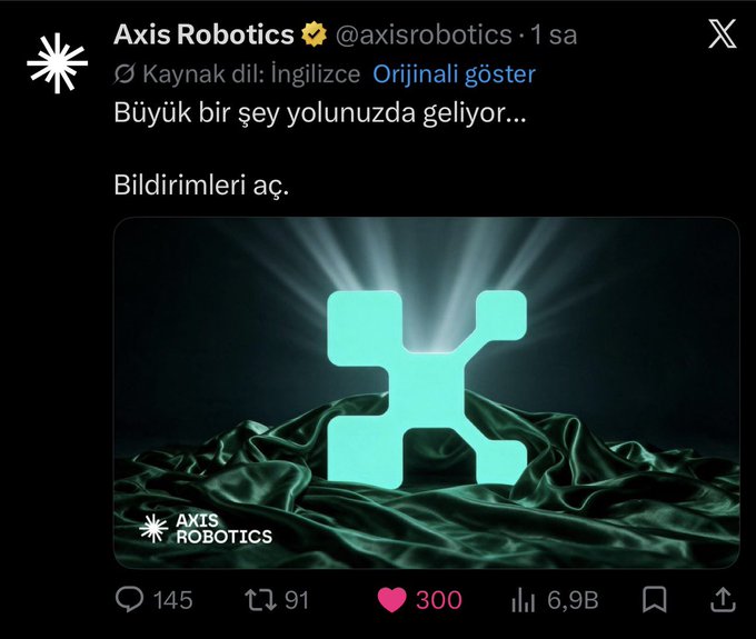 A tweet from Axis Robotics (@axisrobotics) in Turkish stating 'Büyük bir şey yolunuzda geliyor...' (Something big is coming your way...) above a glowing cyan X-shaped logo on dark green silk, with 300 likes and 6.9B views.