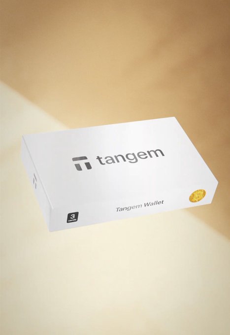 A white product box labeled 'tangem' and 'Tangem Wallet' with a '3' indicating the number of cards inside, displayed against a warm beige background.