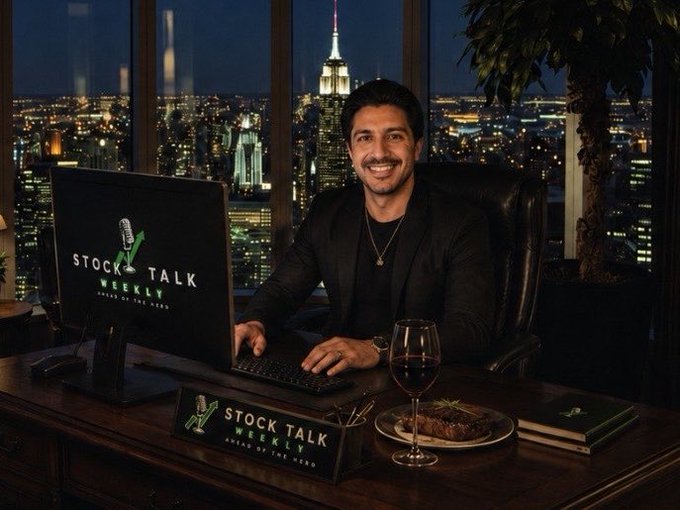 A promotional image for 'Stock Talk Weekly' podcast hosted by a smiling man in a black suit seated at a desk with the New York City skyline at night behind him.