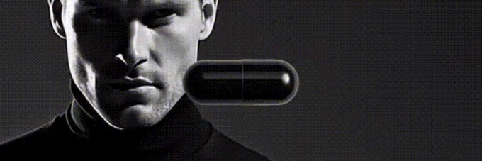 The image features a black-and-white photo of a man with a serious expression, wearing a tight-fitting turtleneck shirt. He has a serious look on his face as he looks towards the camera. In the background, there is an advertisement for a product, which is a black pill that appears to be a "prescription pill." The caption below the image reads: 

"A community member just added a banner image for BP on Moby".