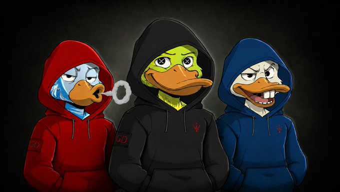 Three cartoon duck mascots wearing hoodies—red, black, and blue—stand together against a dark background, with the center duck smoking a cigar.
