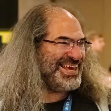 The image features a man with long hair wearing glasses and a black shirt, smiling at the camera. The caption reads "CRAZY: David Schwartz says XRP was intentionally built so Ripple cannot control it, even under U.S. court pressure". This statement is likely referring to the Bitcoin project led by David Schwartz, who has been advocating against Ripple's control over Bitcoin transactions.

The image also contains a person in the background and text that reads "CRAZY: David Schwartz says XRP was intentionally built so Ripple cannot control it, even under U.S. court pressure". This part of the caption is likely meant to emphasize the importance of the message being conveyed by the man in the foreground.