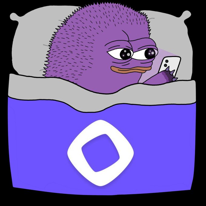 Cartoon illustration of a purple spiky creature with big eyes and a beak, lying in a bed with a purple blanket featuring a white logo, looking at a white smartphone.