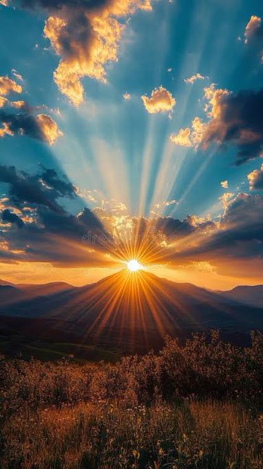 A radiant sunrise beams golden rays through scattered clouds over a mountainous horizon, symbolizing a new dawn of breakthroughs—mirroring the post’s theme of emerging quantum technology from QuipNetwork that's delivering real, tangible solutions rather than empty hype.