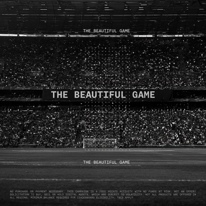 The image features an empty stadium with a banner that reads "The Beautiful Game" written in black text against a white background. The banner also includes a line of text that says "Every match. Every winner. Every move up the leaderboard. Choose your match winners in The Beautiful Game for a chance to earn Bitcoin rewards during the World Cup." This suggests that the image is promoting an event or product related to the World Cup, possibly offering Bitcoin rewards as part of the experience.