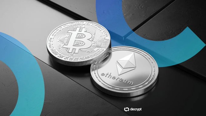 Two silver commemorative coins representing Bitcoin (BTC) and Ethereum (ETH) rest on a dark surface with blue circular design elements, branded with the "decrypt" logo, visually illustrating the two cryptocurrencies whose ETFs saw a surge to $96.1 billion in assets under management amid price-driven gains.