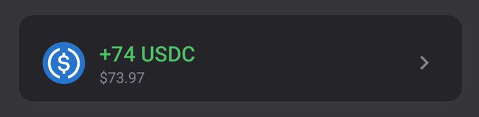A dark notification banner showing '+74 USDC' in green text with '$73.97' below it and a USDC dollar coin logo.