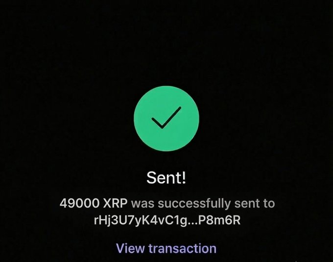 A green checkmark on a dark background confirms a successful transaction, displaying the message "Sent!" with the text "49000 XRP was successfully sent to rHj3U7yK4vC1g…P8m6R" and a "View transaction" link below. The image illustrates the result of a XRP crypto giveaway promotion, where the poster is attempting to send a large amount of XRP (likely the equivalent of $100,000) to participants who comment "$XRP" to win a share of $5,000 distributed among 20 followers.