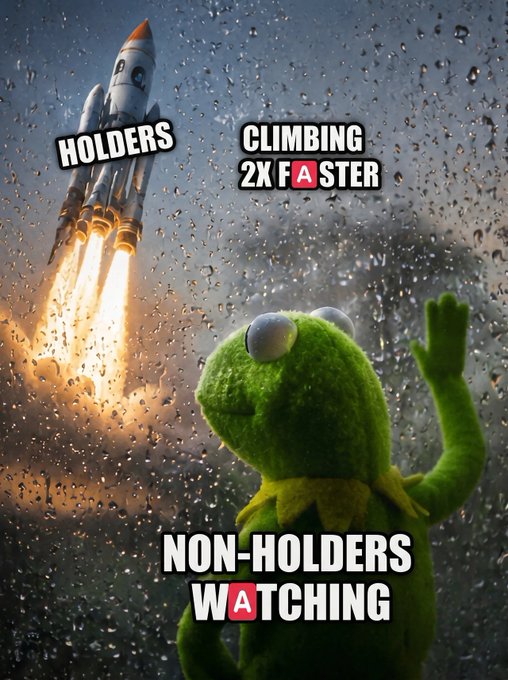 The image features a green frog with big eyes watching an advertisement featuring a rocket ship flying through raindrops. The text above the image reads "Non-holders watching A", which suggests that the ad is promoting a product or service related to non-holders, possibly a new type of watch or a unique way to spend time indoors during rainy weather.