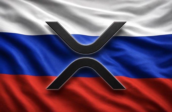 The Russian flag (white, blue, and red stripes) waving in the background with the XRP/Ripple cryptocurrency logo displayed prominently in the center.