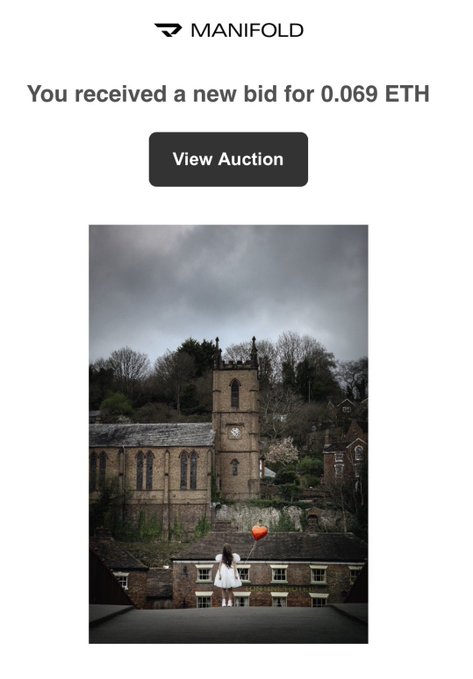 A Manifold notification announces a new bid of 0.069 ETH for an artwork, featuring a moody photograph of a girl in a white dress holding a red balloon in front of a gothic stone church. The image relates to the accompanying post by celebrating the artist's birthday milestone and the first bid placed on their "Built to Last" artwork.
