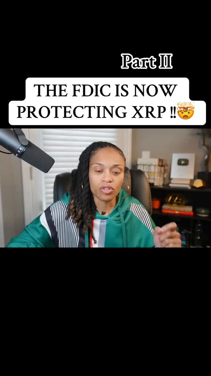 In the image, a woman with dreadlocks is sitting at a desk while talking into a microphone. She appears to be discussing something related to Bitcoin or cryptocurrency. The text "The FDIC is now protecting XRP!" is displayed above her head, indicating that the FDIC has recently started protecting a specific type of cryptocurrency called Ripple. This protection could potentially impact the value and usage of other cryptocurrencies in the market.