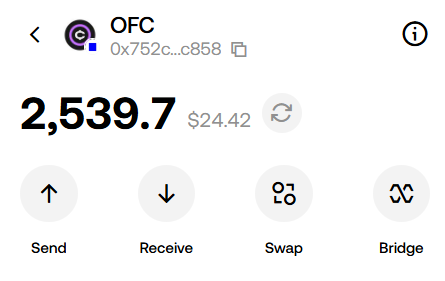 A crypto wallet screen showing a balance of 2,539.7 OFC tokens (worth $24.42) with options to Send, Receive, Swap, and Bridge.